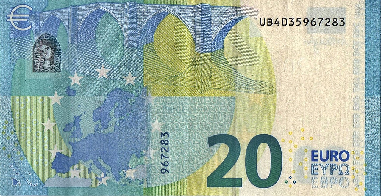 Dettaglio di una banconota da 20 euro con simbolo di allerta per possibili falsificazioni.